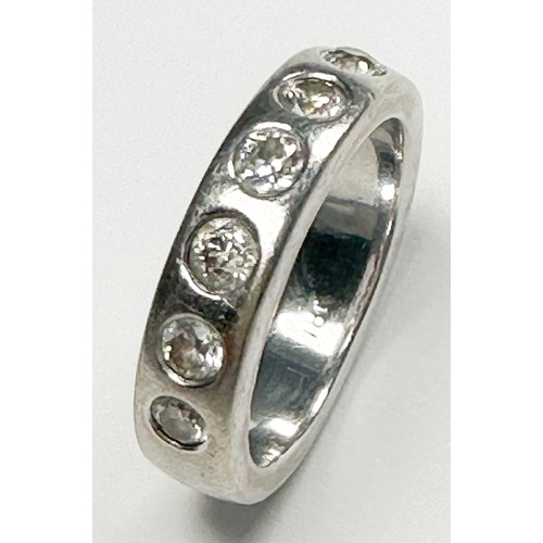 296 - An 18ct white gold diamond ring, flush-set with seven round diamonds, estimated total diamond weight... 