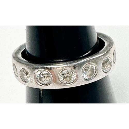 296 - An 18ct white gold diamond ring, flush-set with seven round diamonds, estimated total diamond weight... 