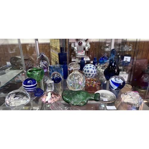 48 - A collection of various glass paperweights, poison bottles etc