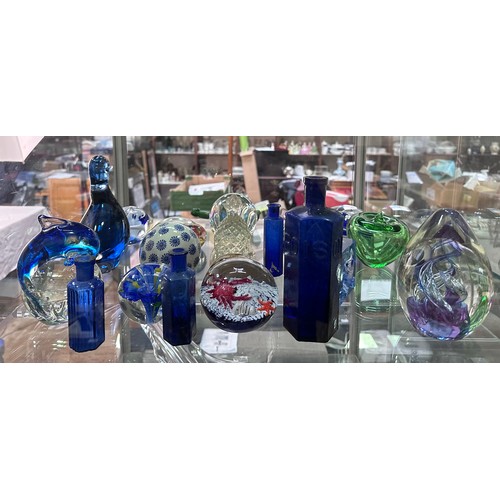 48 - A collection of various glass paperweights, poison bottles etc