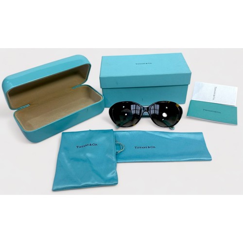 358 - A pair of Ladies Tiffany & Co Sunglasses, TF4098, tortoiseshell frames with opaque sky-blue laminate... 