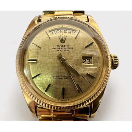 155 - A gents 18ct gold, 36mm Rolex Day-Date wristwatch, the champagne linen dial with gold batons denotin... 