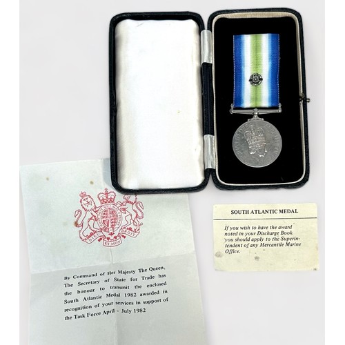 438 - An ERII South Atlantic Medal, with rosette on ribbon, Mercantile Marine, named to V.E. Day, with off... 