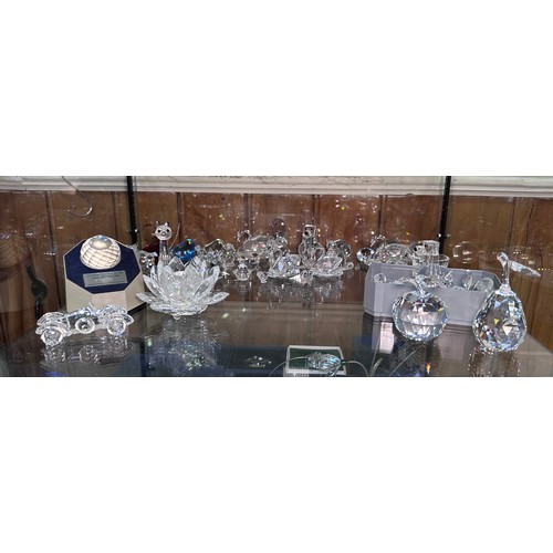 60 - A good collection of assorted Swarovski crystal figures, predominantly boxed examples, including a b... 