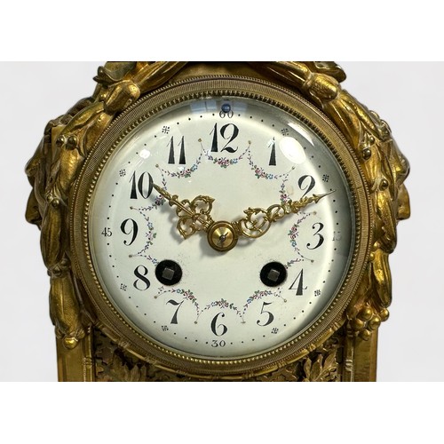 393 - A 19th Century Ormolu mantel clock, with eight-day movement striking a bell, maker's name A.D. Mougi... 