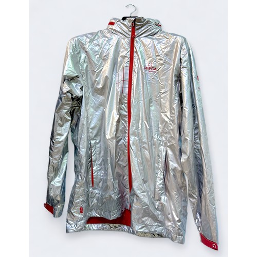 679 - A men’s Omega London 2012 silvered shell jacket, with red and tartan detailing, collapsible hood, th... 