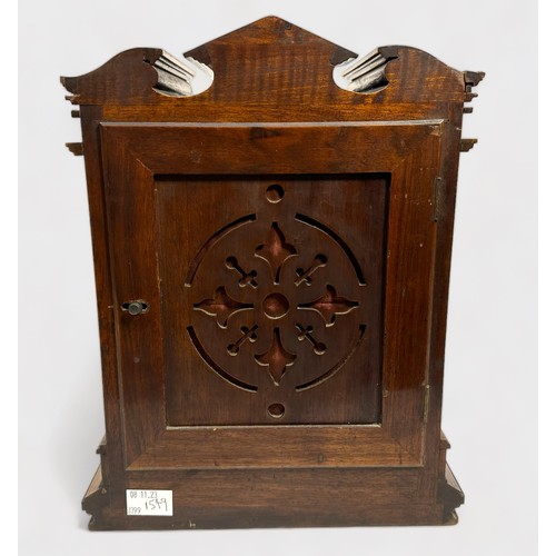 394 - An Edwardian Walnut cased mantel clock of classical temple form, with eight-day movement striking a ... 