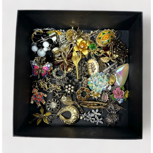 300 - A large collection of assorted brooches gem set examples, floral, animal and automobile design piece... 