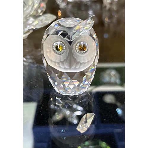 60 - A good collection of assorted Swarovski crystal figures, predominantly boxed examples, including a b... 