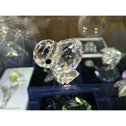 60 - A good collection of assorted Swarovski crystal figures, predominantly boxed examples, including a b... 