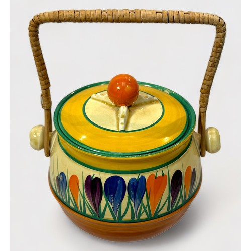 3 - A Clarice Cliff Bizarre Crocus pattern biscuit barrel with cover and basket work handle, with painte... 