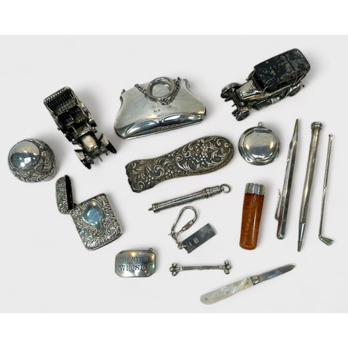 101 - A assortment of various silver collectables including two models of motor cars, a silver collared am... 