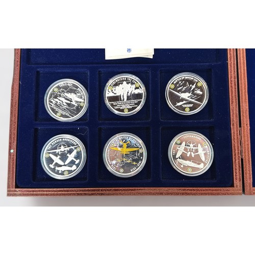 275 - A set of six silver commemorative crowns, with gold highlights, commemorating The Battle of Britain,... 