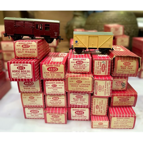 494 - A collection of twenty-one various boxed Hornby-Dublo goods wagons, vans, etc., housed in red/white ... 