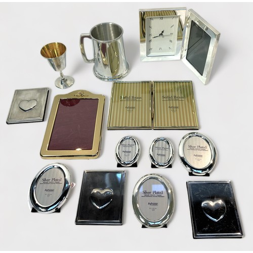 98 - A collection of assorted silver-plated wares including a three-piece tea set by Walker & Hall, a cir... 
