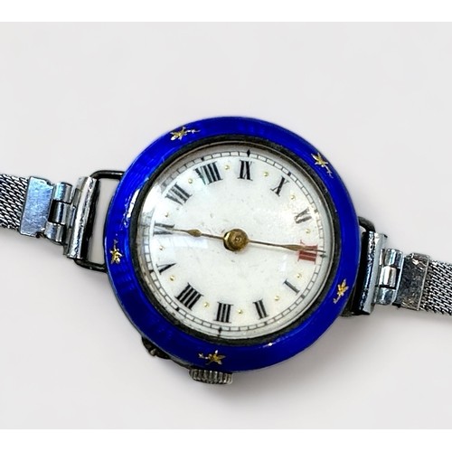 132 - A ladies early 20th century silver and enamel wristwatch, Swiss movment, white enamel dial with Roma... 