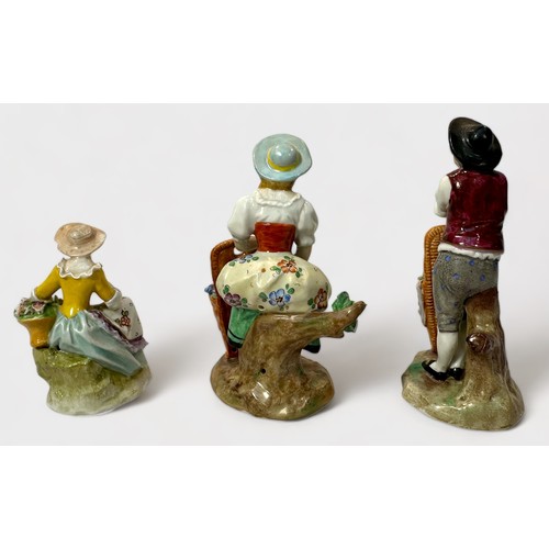 33 - A pair of 19th Century Sitzendorf porcelain figures of fruit sellers, 11cm, and another of a flower ... 