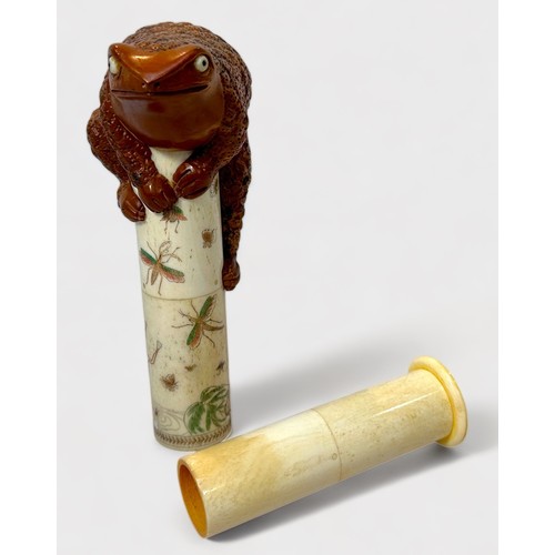 78 - A Japanese Meiji period (1868-1912) carved boxwood and bone cylindrical scroll holder, the tube engr... 