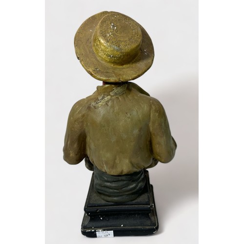 13 - A 1920s painted ceramic figure of an Afro-American cotton-picker in the style of artist William Aike... 