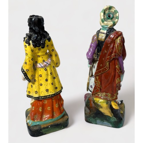 32 - A pair of 19th century continental porcelain figures of an Ottoman couple, painted in polychrome ena... 