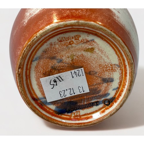 10 - A Moorcroft Pottery ovoid vase with 'weathered' orange lustre glaze, impressed mark to base, 16cm hi... 