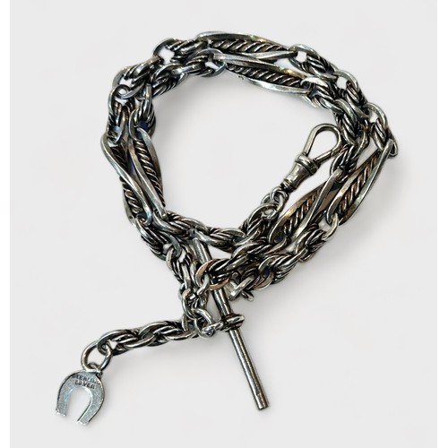 104 - A silver Albert chain of twisted link and cable design, with bulldog clip, t-bar and horseshoe charm... 