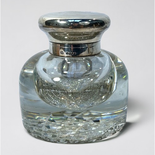 105 - A Victorian Goliath cut glass inkwell of domed form, with silver mounted top and hinged domed cover ... 