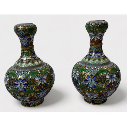 79 - An unusual pair of cloisonné vases, of globular form, with waisted neck to bulbous rim, the entirety... 