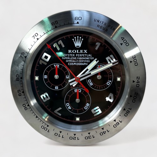 137 - A Rolex authorised dealer display wall clock, modelled as a Rolex Daytona, the black dial with Arabi... 