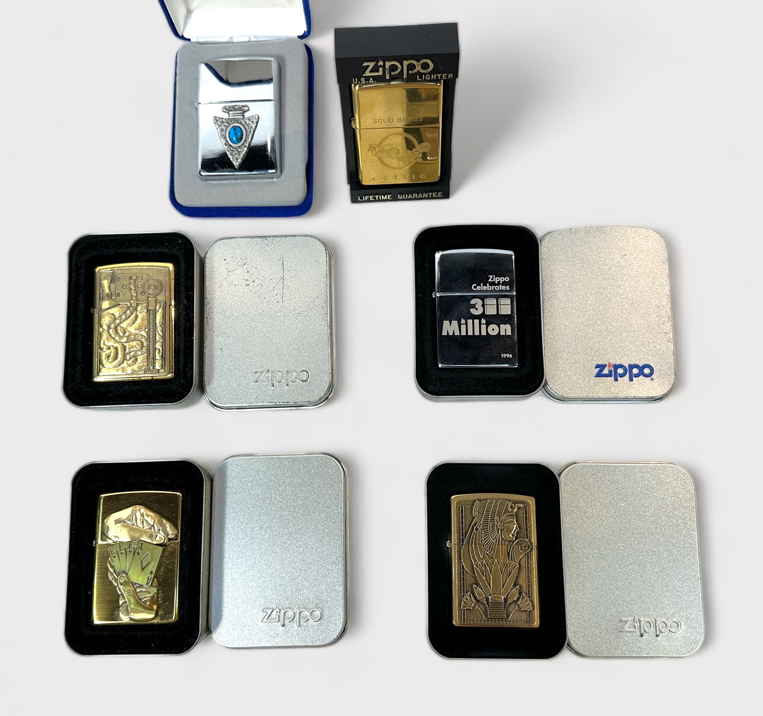 Six various cased Zippo brass and polished chrome collectible