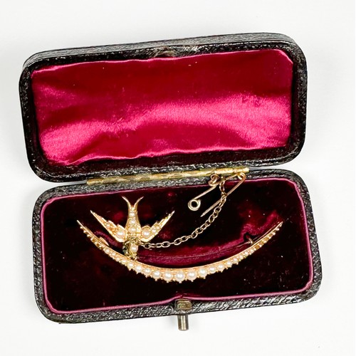 164 - An unmarked Edwardian gold and seed pearl brooch, of crescent form, set with graduated blister seed ... 