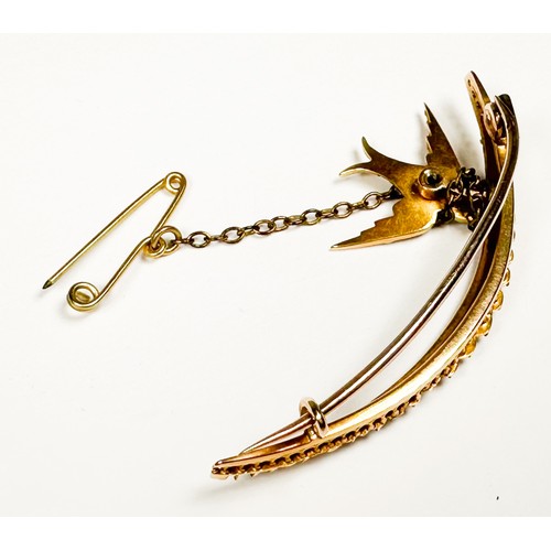 164 - An unmarked Edwardian gold and seed pearl brooch, of crescent form, set with graduated blister seed ... 