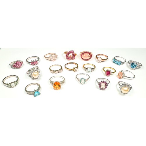 184 - Twenty various silver dress rings, set with diamonds and coloured stones, including ruby, and rose q... 