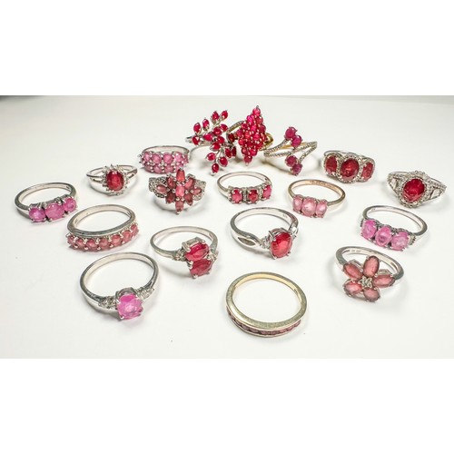 185 - Eighteen various silver ruby and diamond dress rings, total weight 61.8 grams.