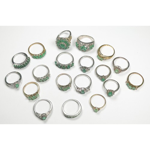 186 - Nineteen various silver emerald and diamond dress rings, total weight 53.6 grams.