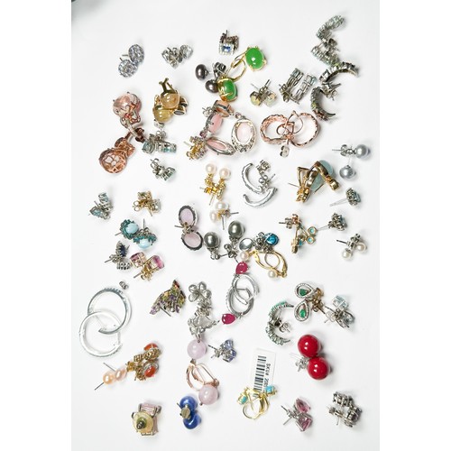 190 - Fifty pairs of assorted earrings, set with diamonds and other various coloured gemstones, including ... 