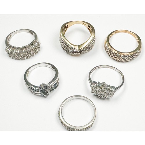 214 - Six assorted silver rings, set with diamonds, total weight 23.3 grams.