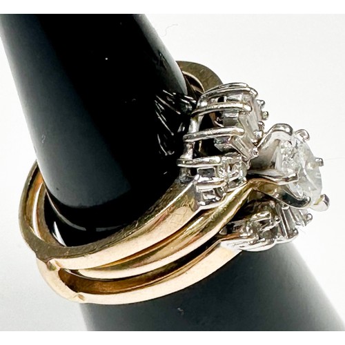 217 - A 14ct yellow gold trilogy ring, set with a marquise cut diamond to the centre, estimated weight 0.3... 