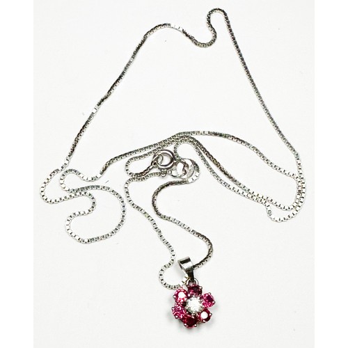 233 - An 18ct white gold, diamond and ruby cluster pendant and fine box-link necklace, central round brill... 