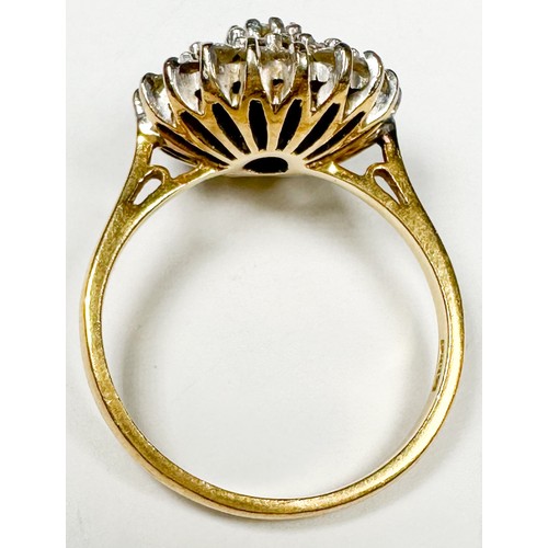 238 - An 18ct yellow gold dress ring, claw set with round brilliant cut diamonds, in a cluster design, est... 