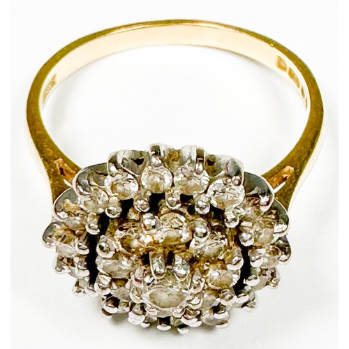 238 - An 18ct yellow gold dress ring, claw set with round brilliant cut diamonds, in a cluster design, est... 