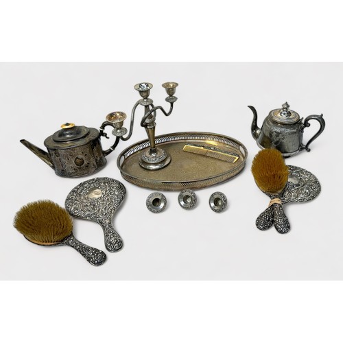 114 - A five-piece silver backed dressing table set by W J Myatt & Co. comprising two brushes, two mirrors... 