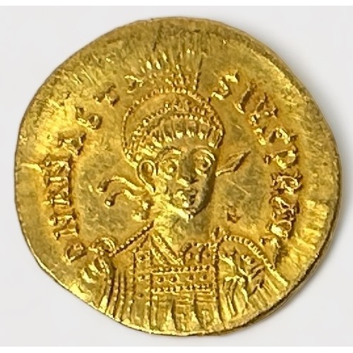 277 - A Byzantine Gold Solidus of Anastasium AD 491-518, Obverse with helmeted pearl-diademed and cuirasse... 