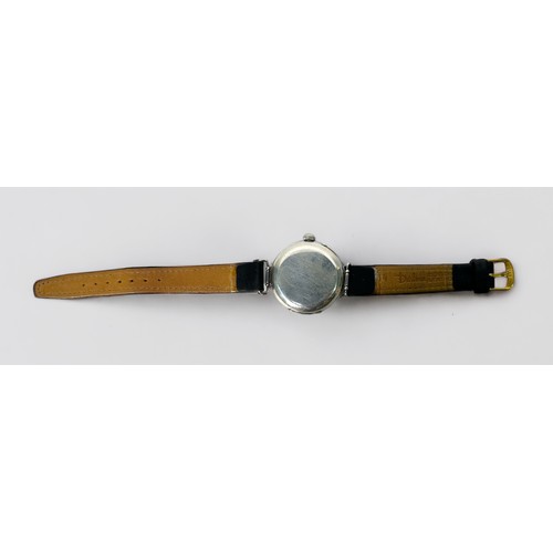 144 - An early 20th century silver cased Zenith trench watch, the white enamel dial with Roman numerals de... 