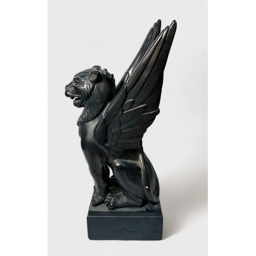 60 - A cast and patinated ceramic sculpture of a winged lion, by 'Austin Sculpture,' 46cm high, together ... 