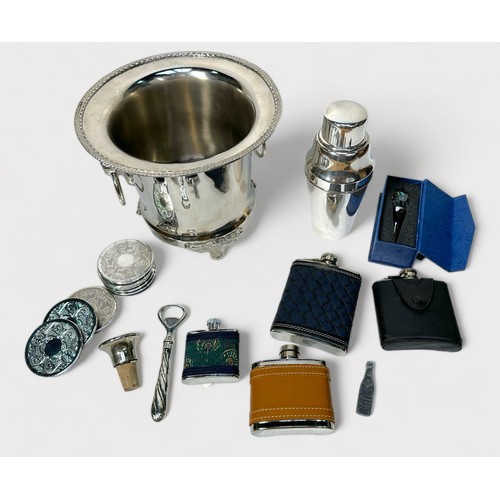 120 - A collection of assorted silver-plated bar items including a twin-handles wine cooler with lions mas... 