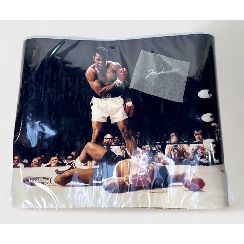 382 - An iconic image of Muhammad Ali standing over Sonny Liston, bearing a Muhammad Ali signature in silv... 