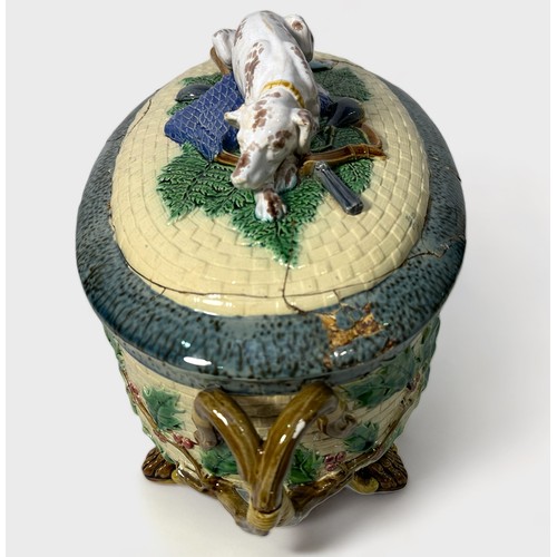 66 - A 19th century Minton Majolica game pie tureen, cover and liner, of oval form with rustic handles, t... 