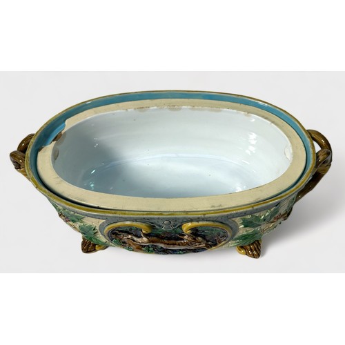 66 - A 19th century Minton Majolica game pie tureen, cover and liner, of oval form with rustic handles, t... 