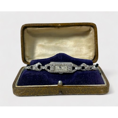 148 - A ladies Art Deco period white metal and diamond cocktail watch, with silvered dial and Roman numera... 